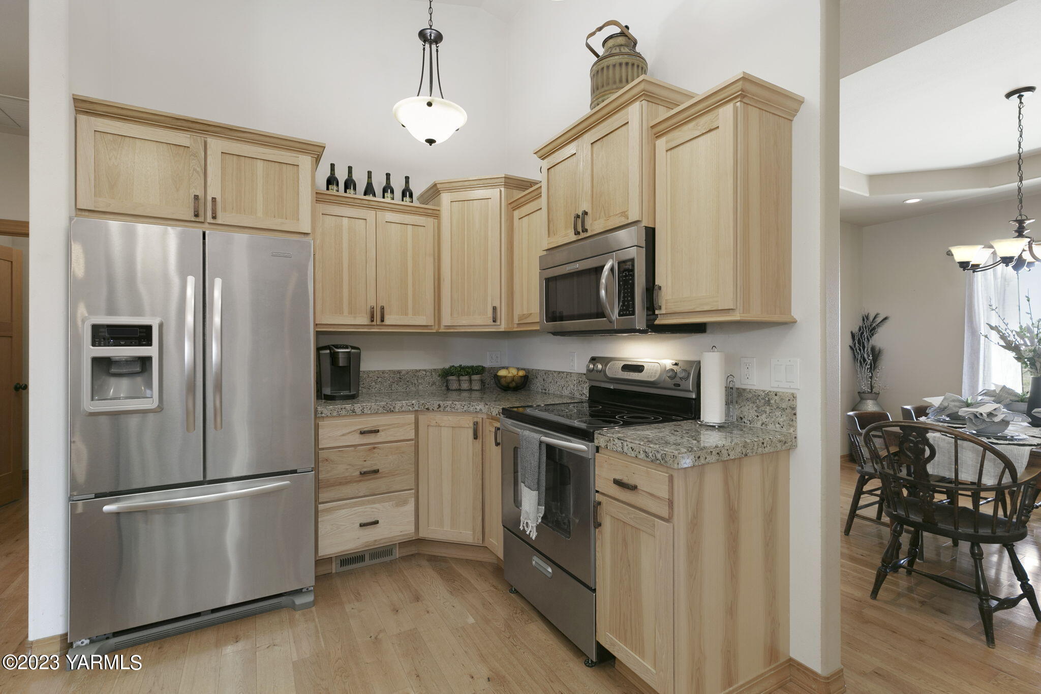1870 Slavin Road Yakima, WA 98903 - Photo 9 of 27 a kitchen with stainless steel appliances a refrigerator sink and cabinets