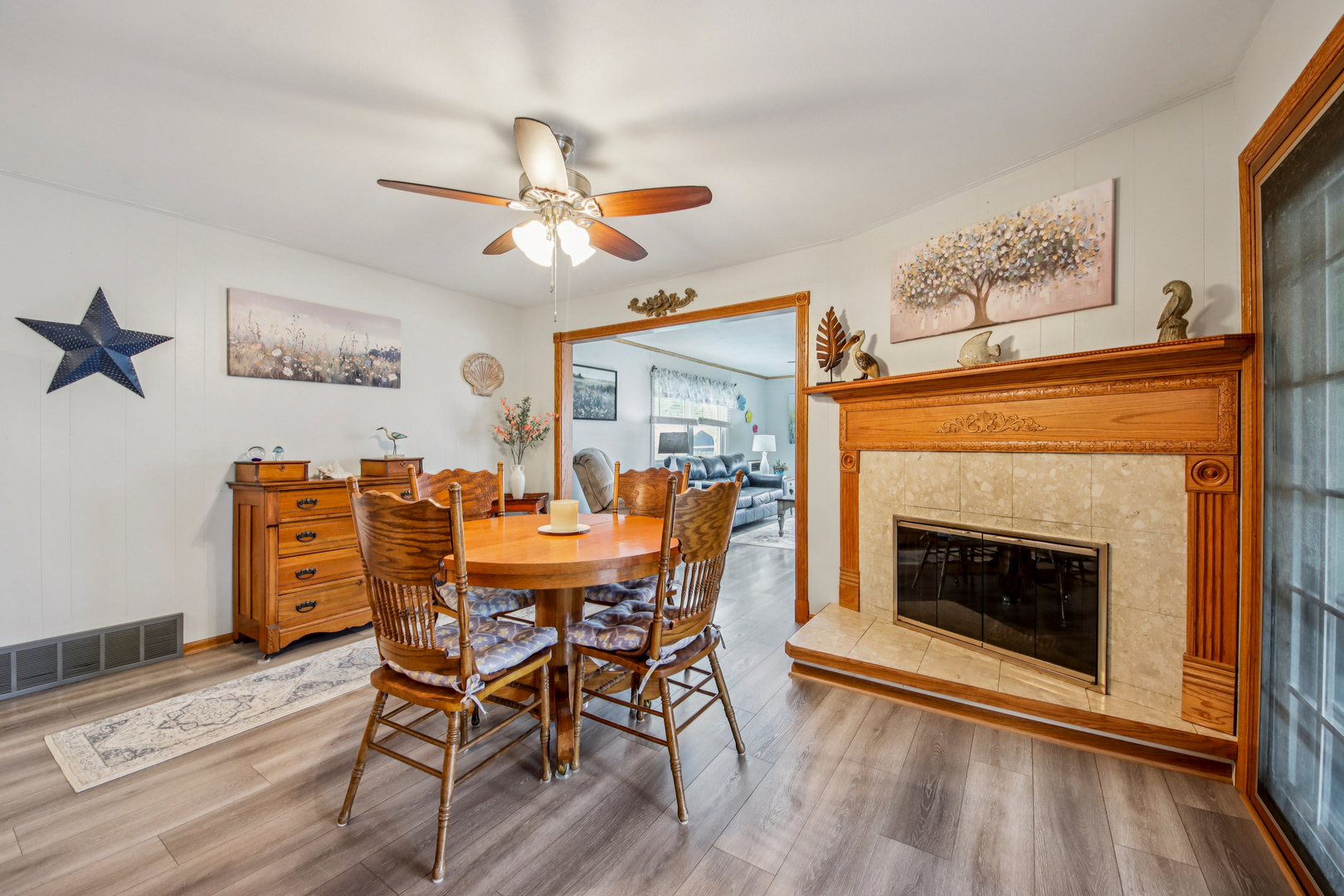 1618 Pine Trail Sycamore, IL 60178 - Photo 11 of 33 a view of a dining room with furniture wooden floor and a fireplace
