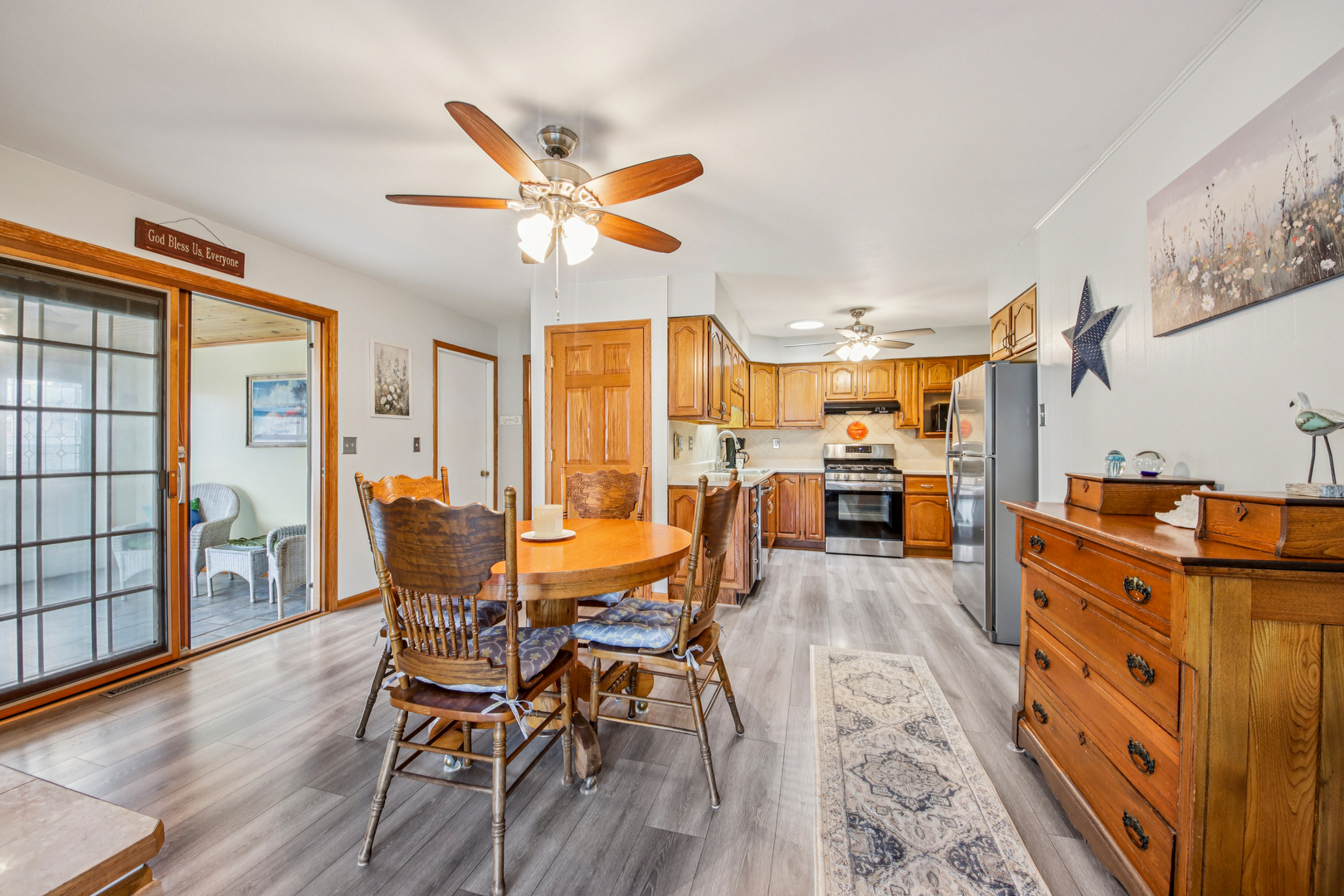 1618 Pine Trail Sycamore, IL 60178 - Photo 12 of 33 a view of a dining room with furniture and wooden floor
