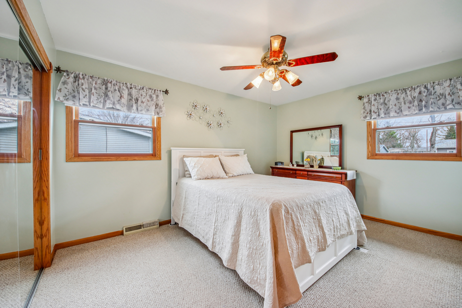 1618 Pine Trail Sycamore, IL 60178 - Photo 19 of 33 a bedroom with a bed and a chandelier