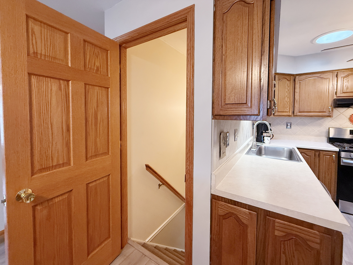 1618 Pine Trail Sycamore, IL 60178 - Photo 23 of 33 a kitchen with stainless steel appliances granite countertop a refrigerator a sink and dishwasher with wooden cabinets