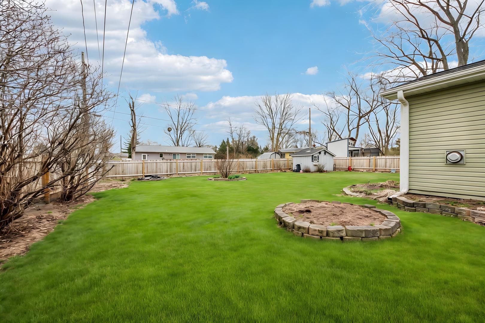 1618 Pine Trail Sycamore, IL 60178 - Photo 31 of 33 a view of a backyard with a garden