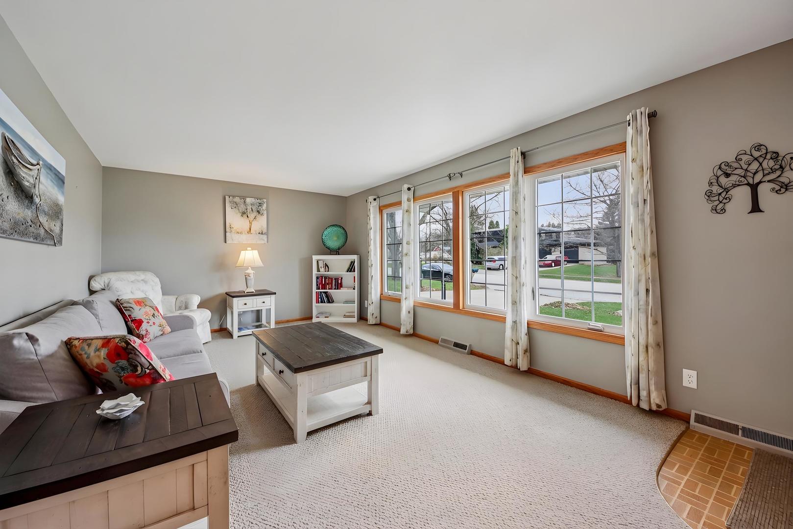 1618 Pine Trail Sycamore, IL 60178 - Photo 5 of 33 a living room with furniture and a large window