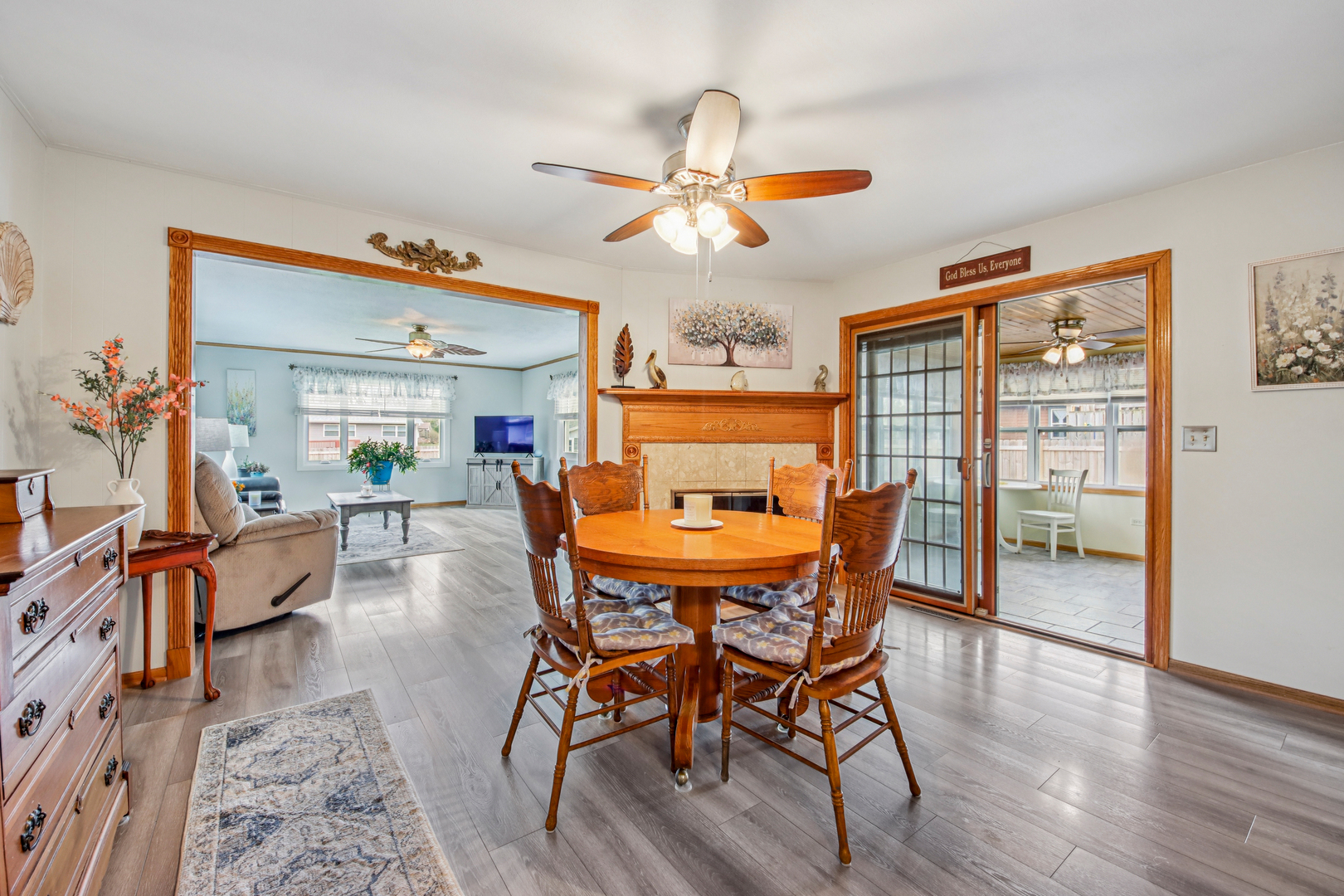 1618 Pine Trail Sycamore, IL 60178 - Photo 10 of 33 a dining room with furniture a chandelier and wooden floor