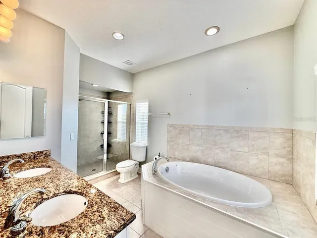a bathroom with a bathtub and a sink