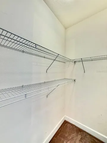 a view of a room with racks on the wall