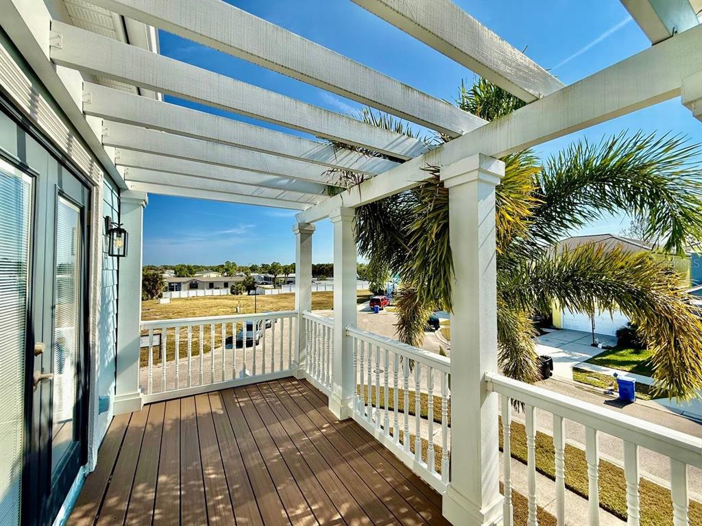 6545 Simone Shores Circle Apollo Beach, FL 33572 - Photo 27 of 46 a view of a porch with potted plants