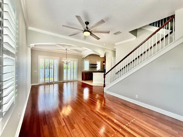 a view of interior space with wooden floor and white walls