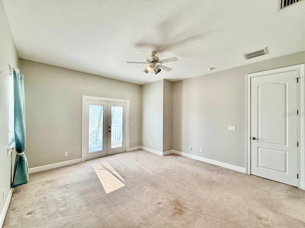 6545 Simone Shores Circle Apollo Beach, FL 33572 - Photo 33 of 46 an empty room with fan and windows