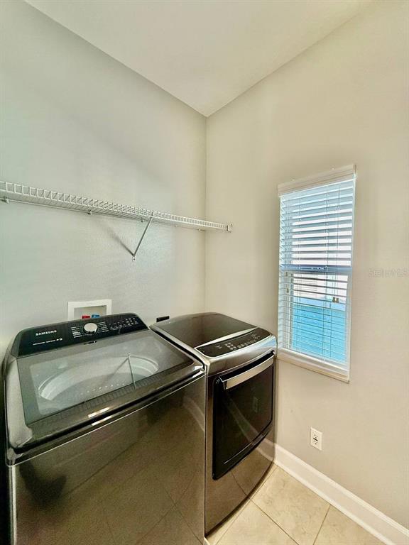 6545 Simone Shores Circle Apollo Beach, FL 33572 - Photo 38 of 46 a utility room with dryer and washer