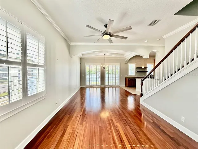 a view of an entryway with wooden floor