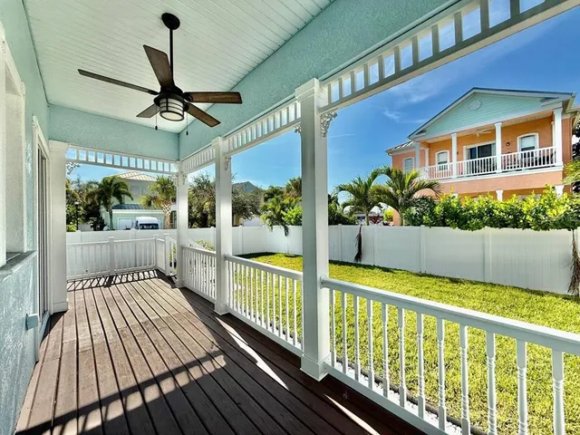 a view of a porch with wooden floor