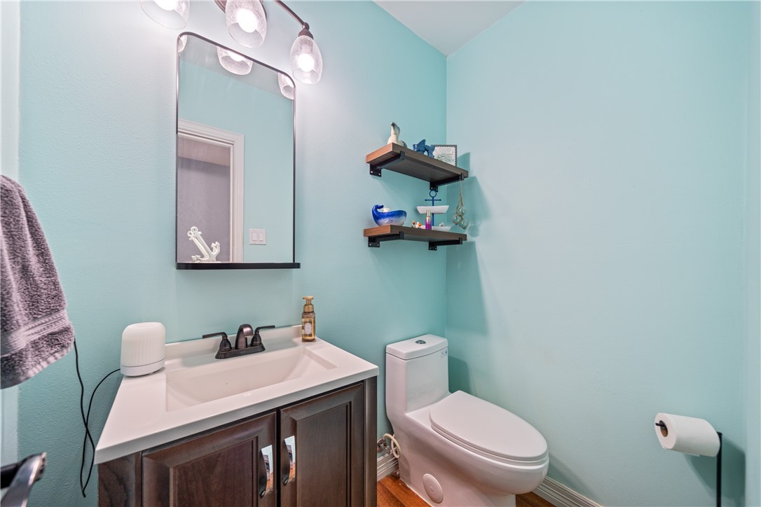 2217 Post Oak Drive Portland, TX 78374 - Photo 23 of 39 a bathroom with a toilet sink and mirror