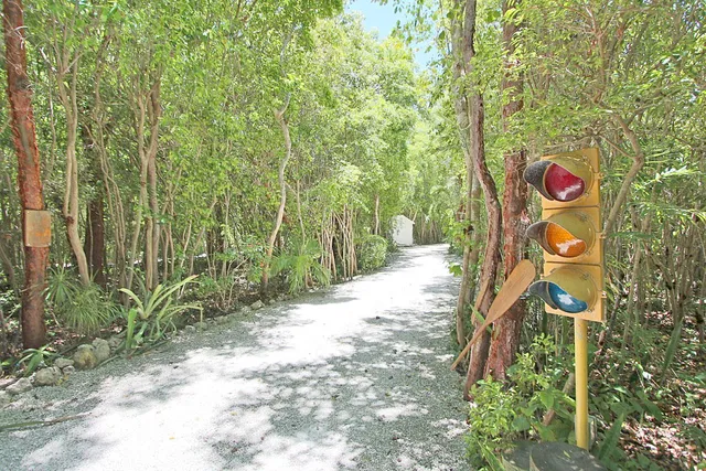 a kitchen with granite countertop a sink a stove and cabinets