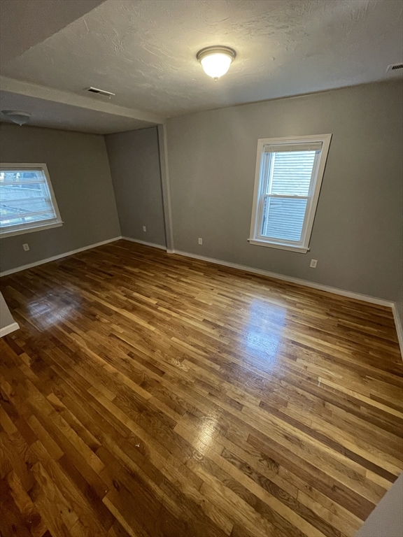 321 Wood Avenue, Unit 2 Boston, MA 02136 - Photo 5 of 9 a view of empty room with wooden floor