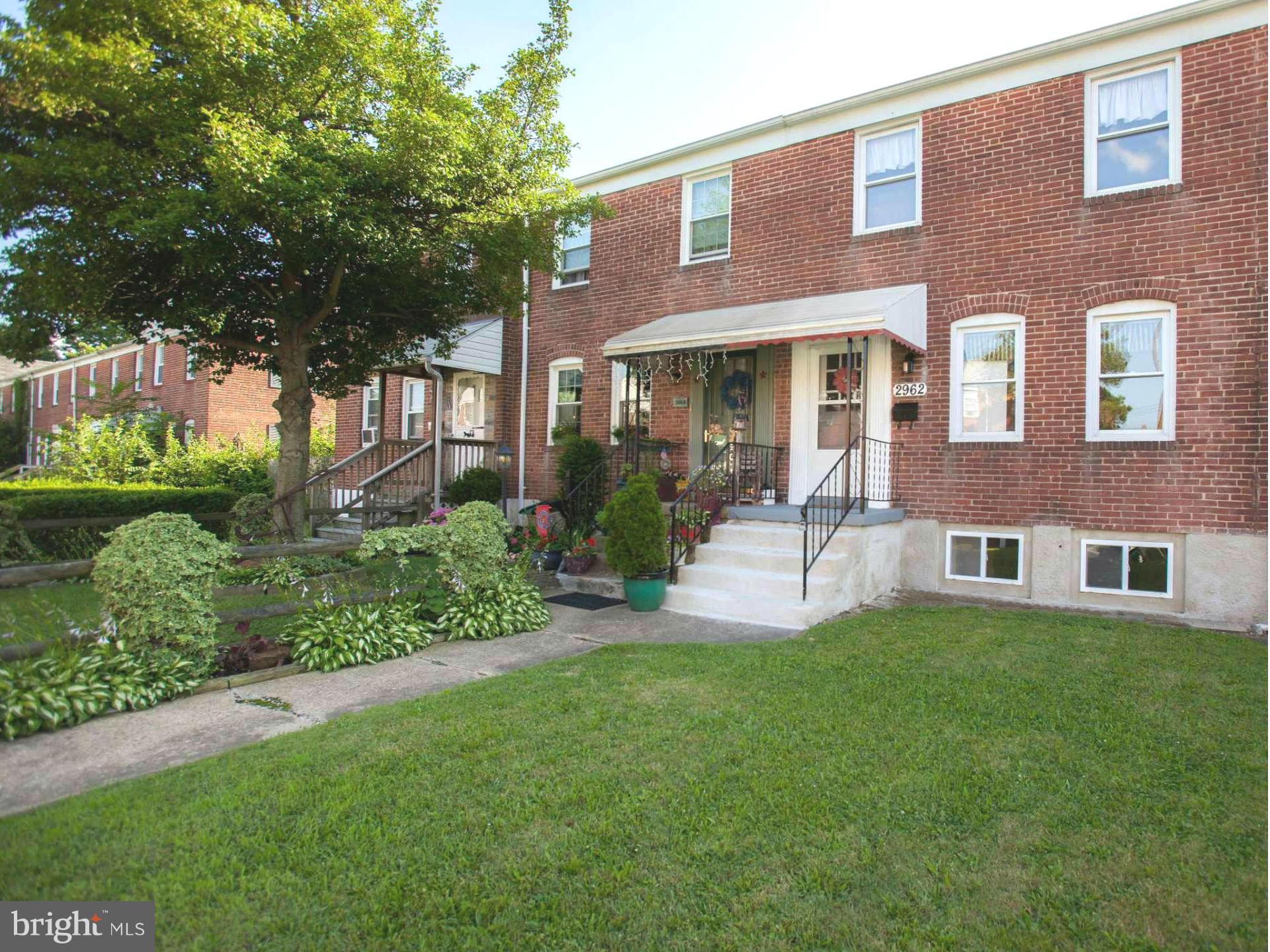 2962 Cornwall Road Dundalk, MD 21222 - Photo 2 of 28 a view of a brick building next to a yard