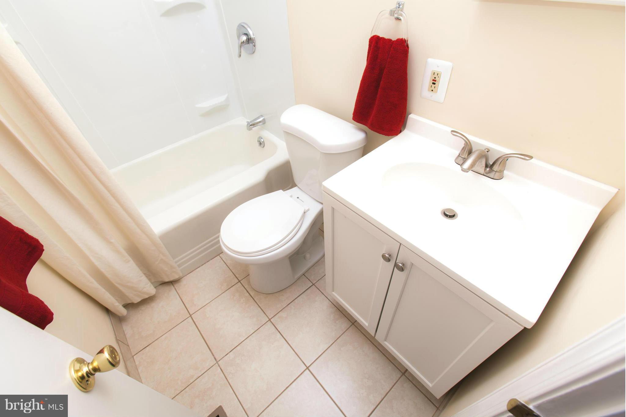 2962 Cornwall Road Dundalk, MD 21222 - Photo 12 of 28 a bathroom with a sink toilet and vanity