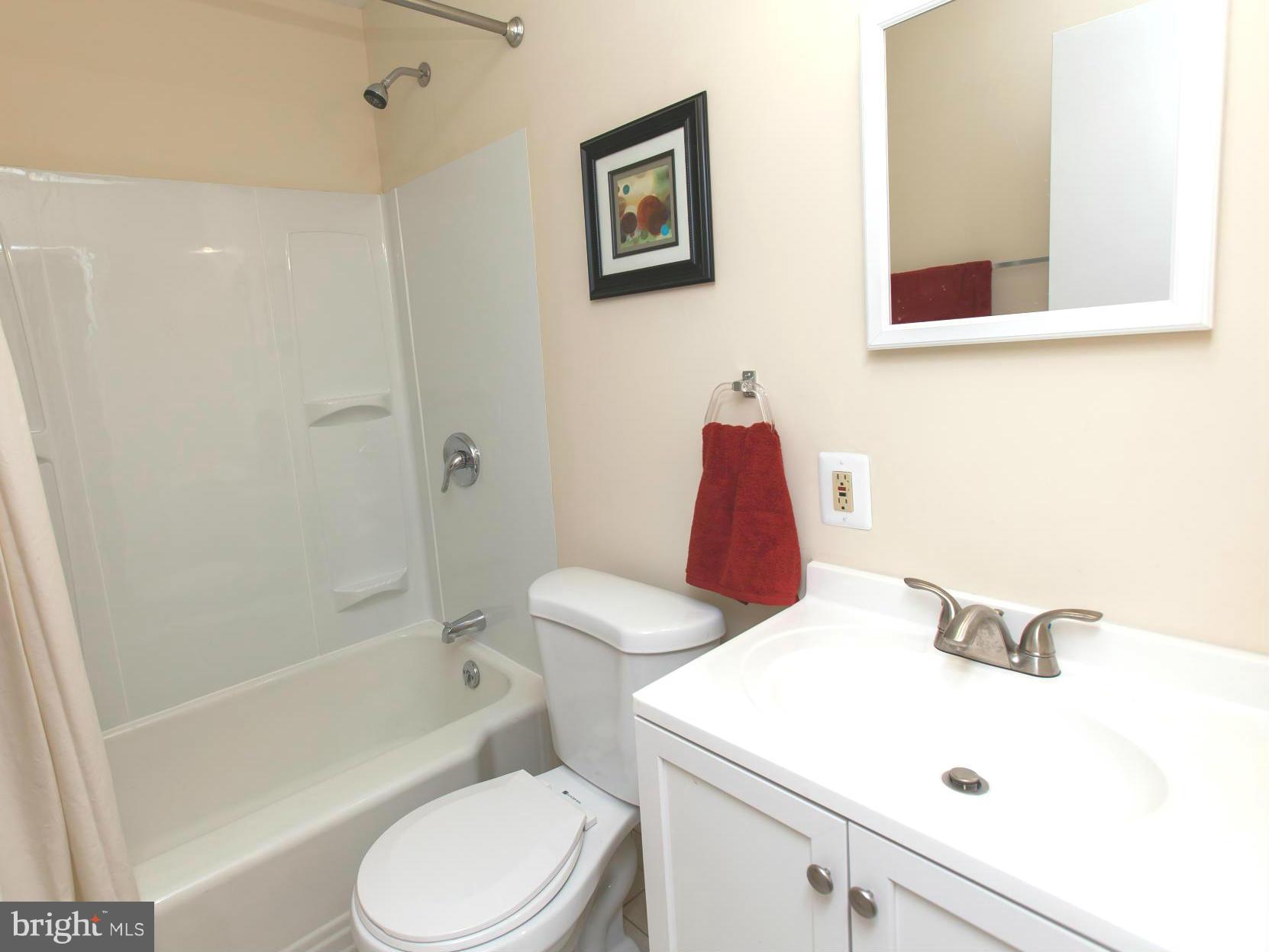 2962 Cornwall Road Dundalk, MD 21222 - Photo 13 of 28 a bathroom with a sink a toilet and shower