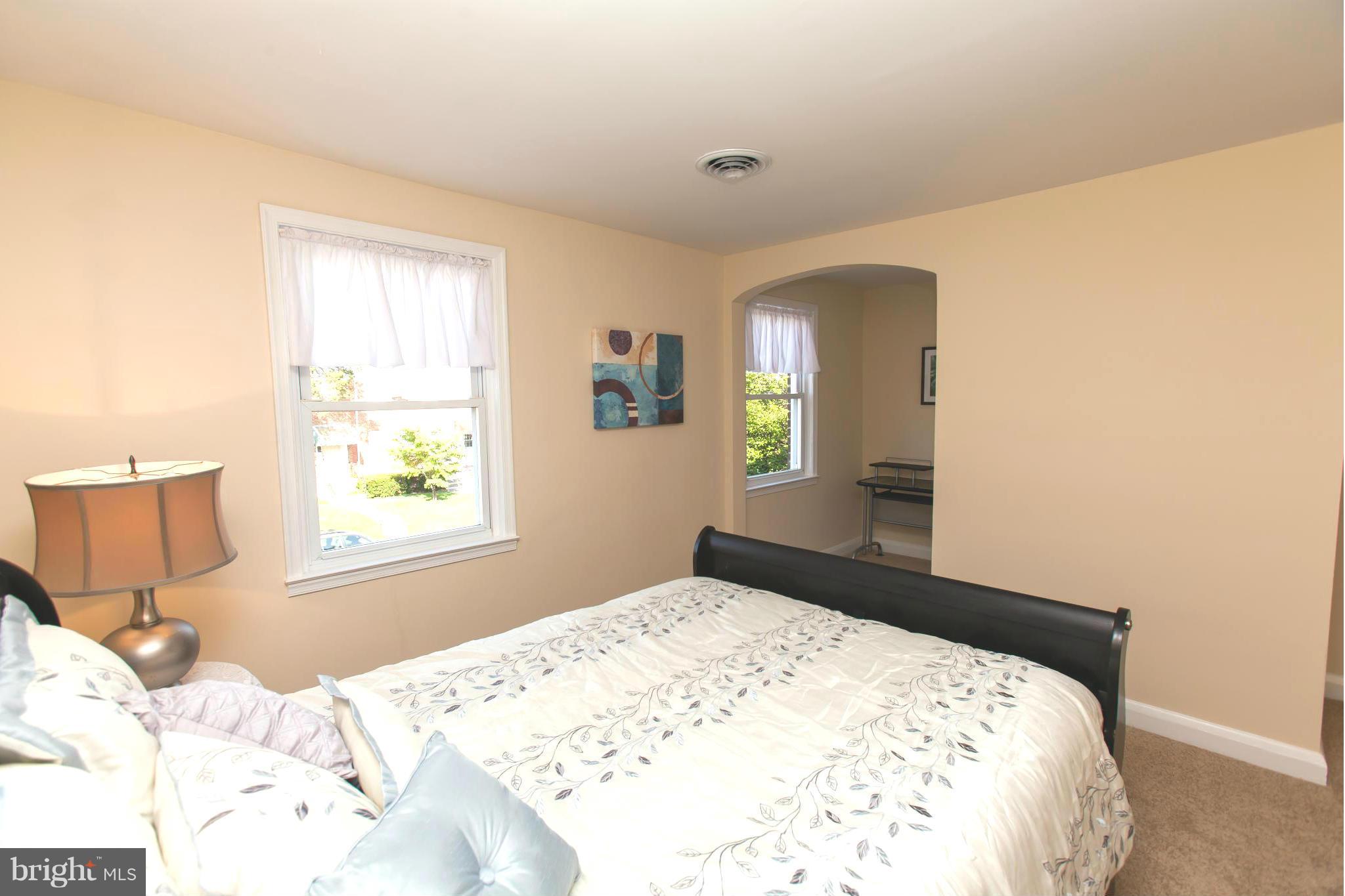 2962 Cornwall Road Dundalk, MD 21222 - Photo 16 of 28 a bedroom with a bed and a window