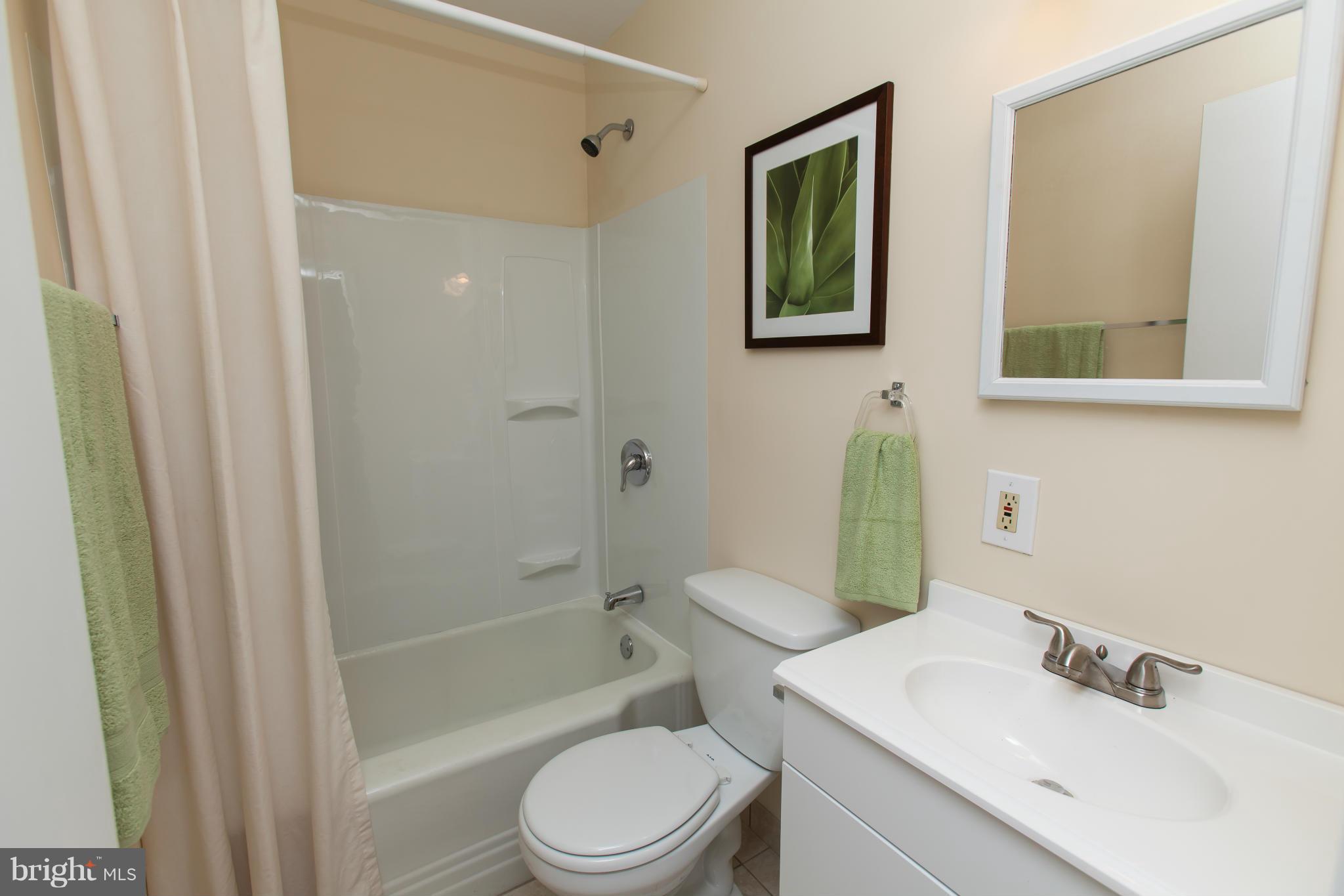 2962 Cornwall Road Dundalk, MD 21222 - Photo 19 of 28 a bathroom with a sink toilet and shower