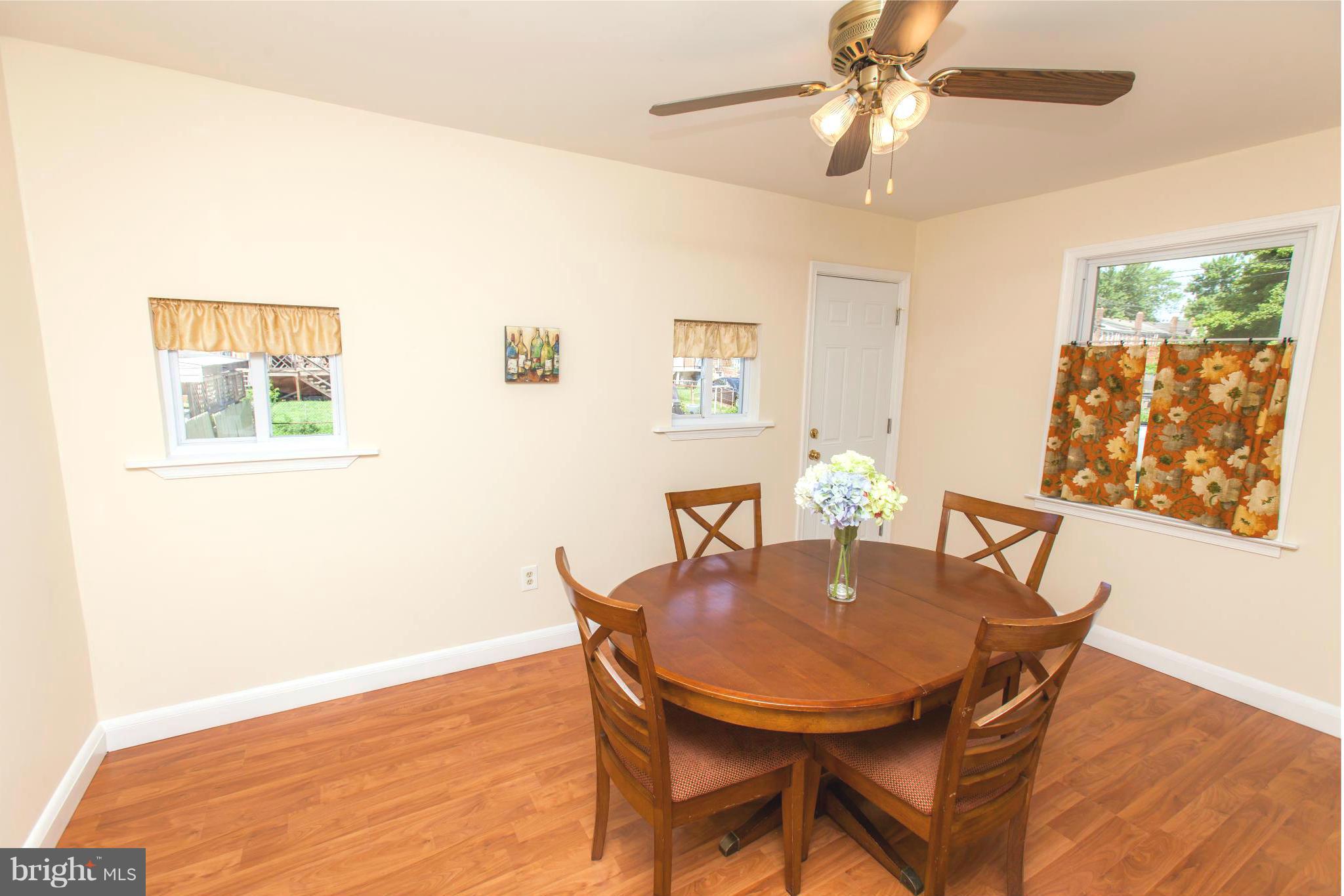 2962 Cornwall Road Dundalk, MD 21222 - Photo 7 of 28 a view of a dining room with furniture and wooden floor