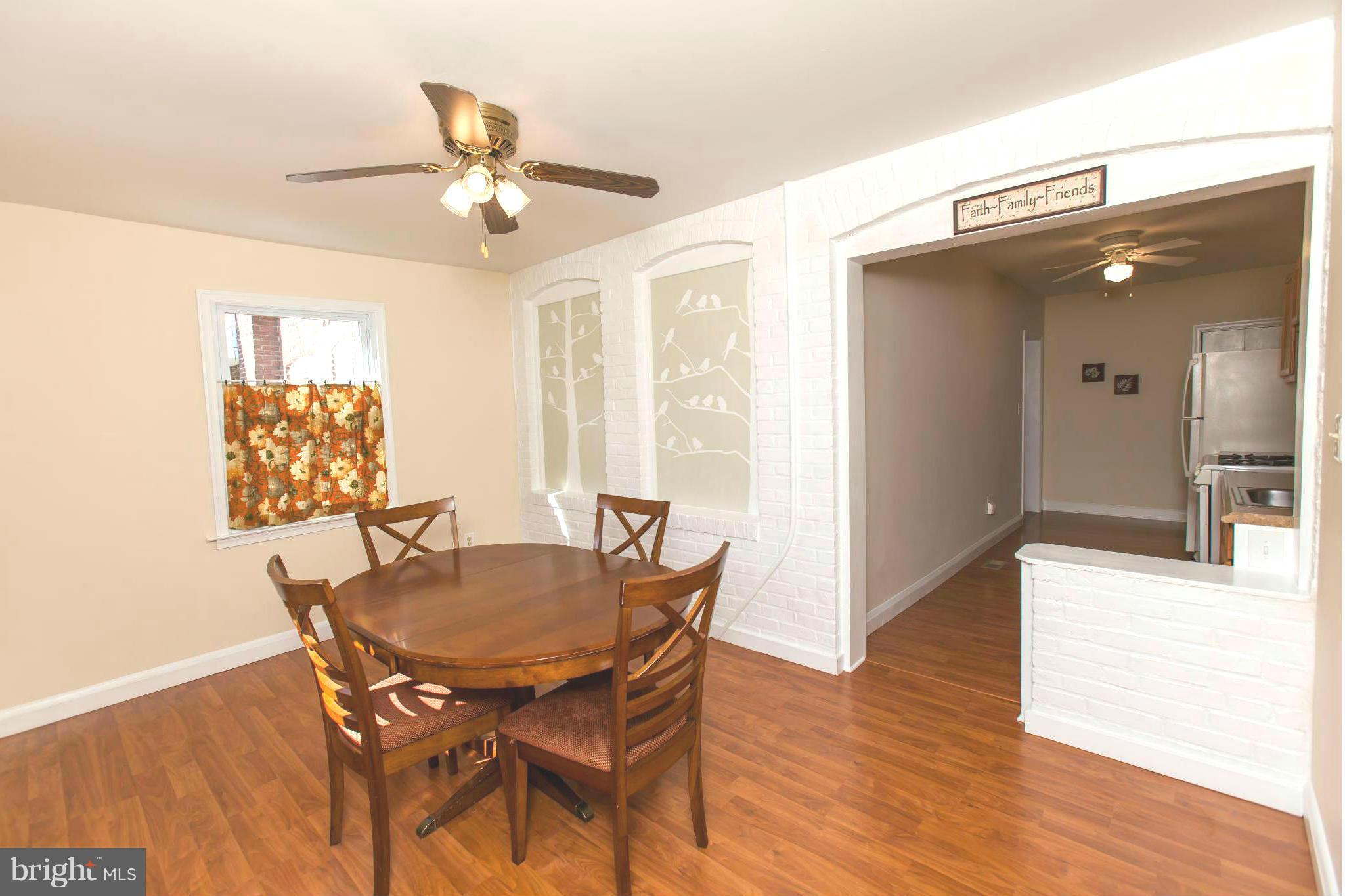 2962 Cornwall Road Dundalk, MD 21222 - Photo 8 of 28 a view of a dining room with furniture and wooden floor