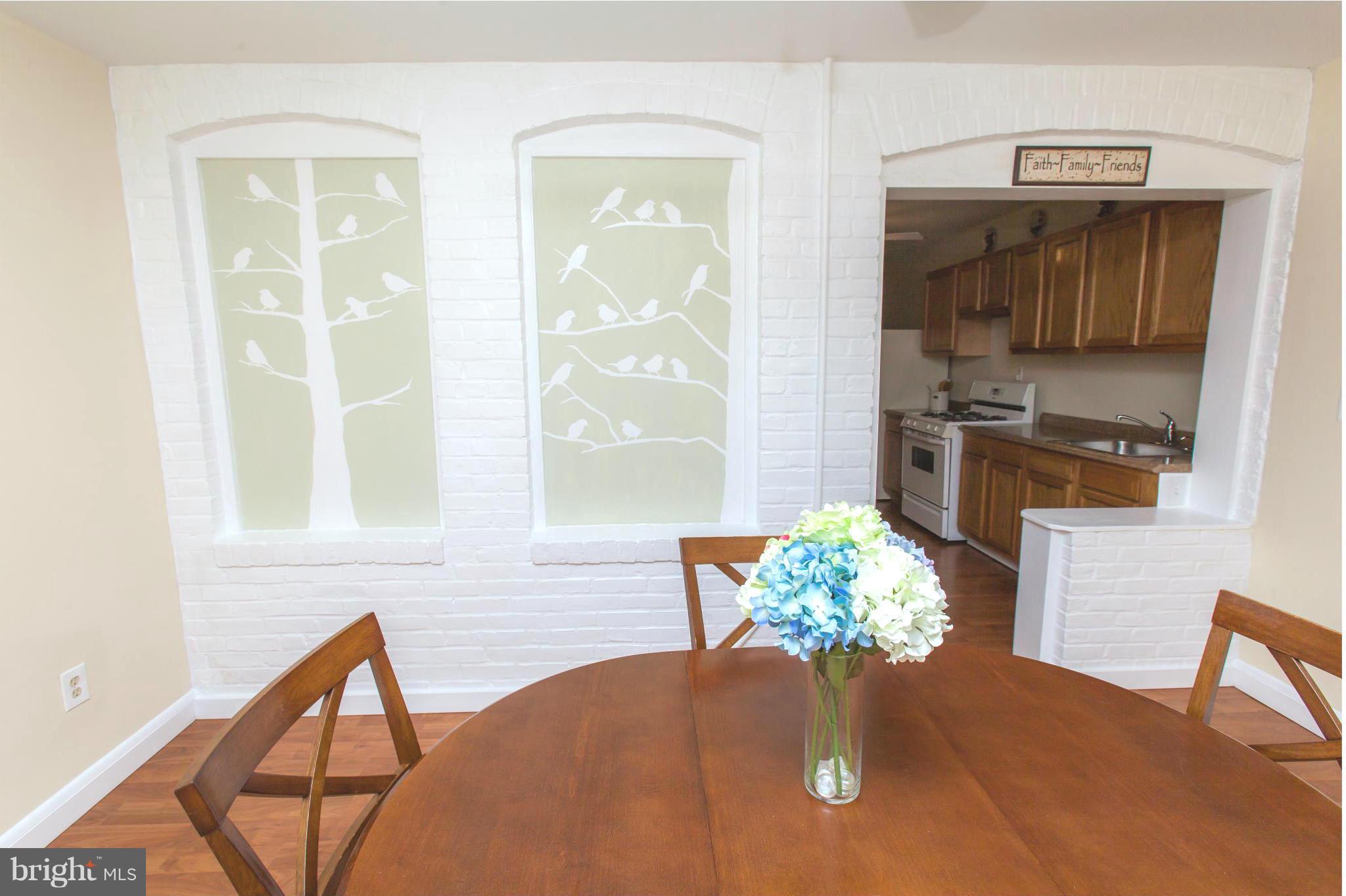 2962 Cornwall Road Dundalk, MD 21222 - Photo 9 of 28 a living room with furniture flowerpot and wooden floor