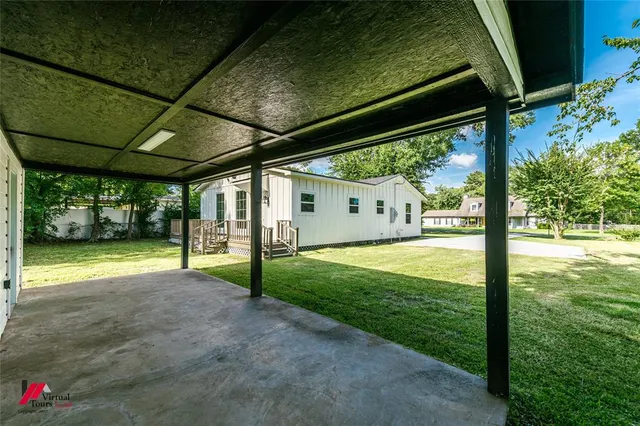a view of a backyard with garden
