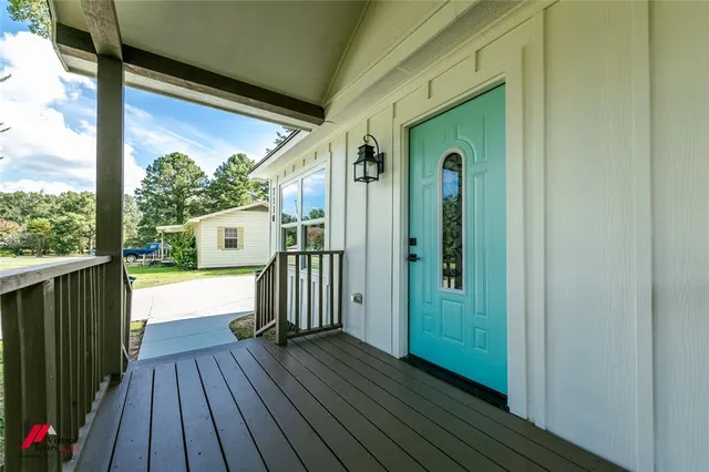 a view of a porch with wooden floor
