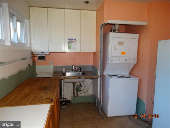12 Devonwood Road Wayne, PA 19087 - Photo 5 of 16 a room with a chair and a table