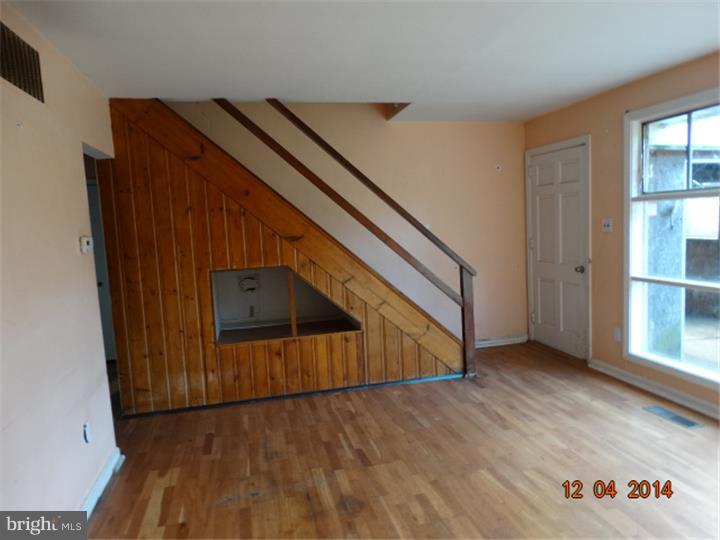 12 Devonwood Road Wayne, PA 19087 - Photo 8 of 16 an empty room with wooden floor and windows