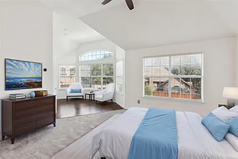 a bed room with furniture and a flat screen tv
