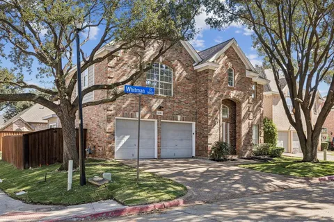 a front view of house with a garden