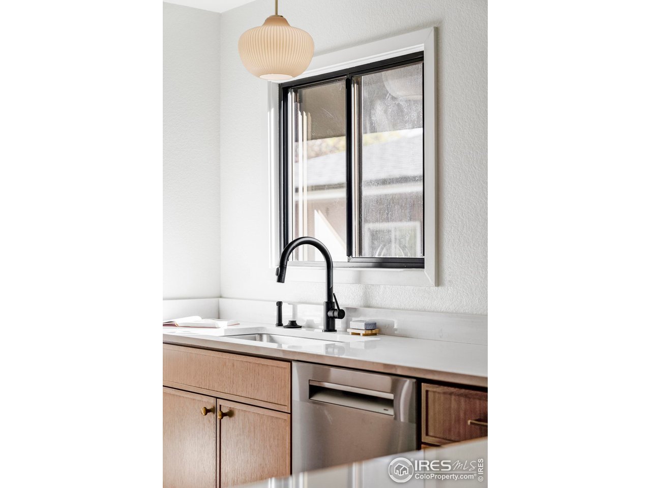 1112 Robertson Street Fort Collins, CO 80524 - Photo 13 of 40 a sink and a mirror