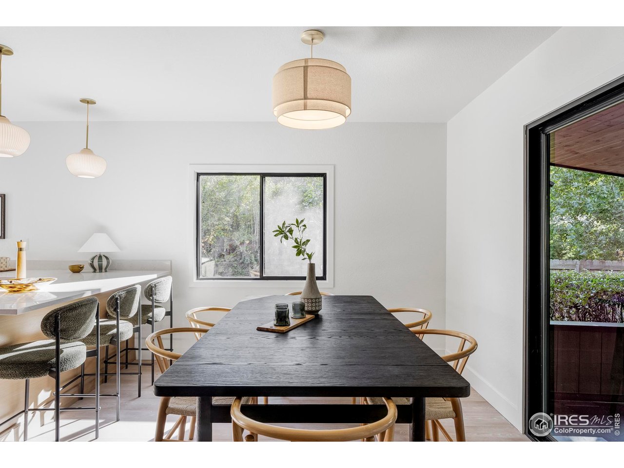 1112 Robertson Street Fort Collins, CO 80524 - Photo 16 of 40 a view of a dining room with a table and chairs