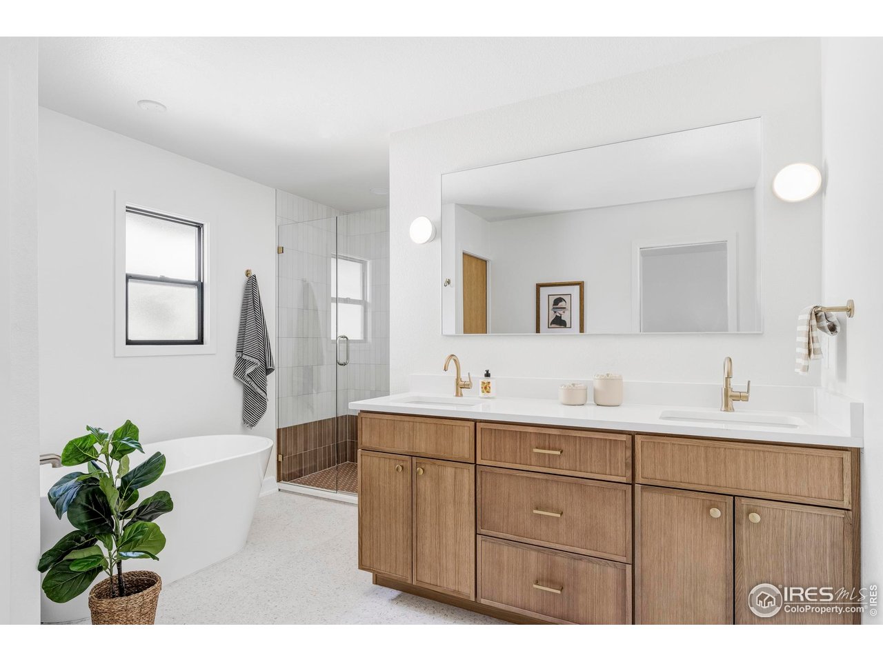 1112 Robertson Street Fort Collins, CO 80524 - Photo 22 of 40 a bathroom with a double vanity sink and a mirror