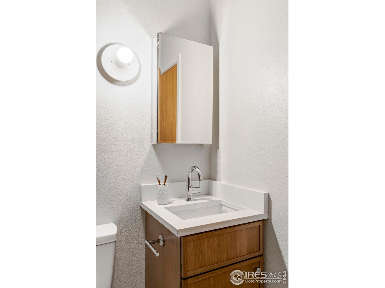 1112 Robertson Street Fort Collins, CO 80524 - Photo 26 of 40 a bathroom with a sink and a mirror