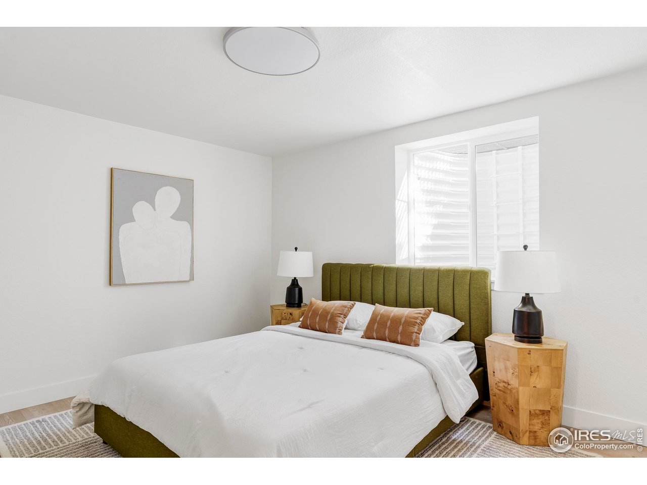 1112 Robertson Street Fort Collins, CO 80524 - Photo 33 of 40 a bedroom with a bed and a night stand