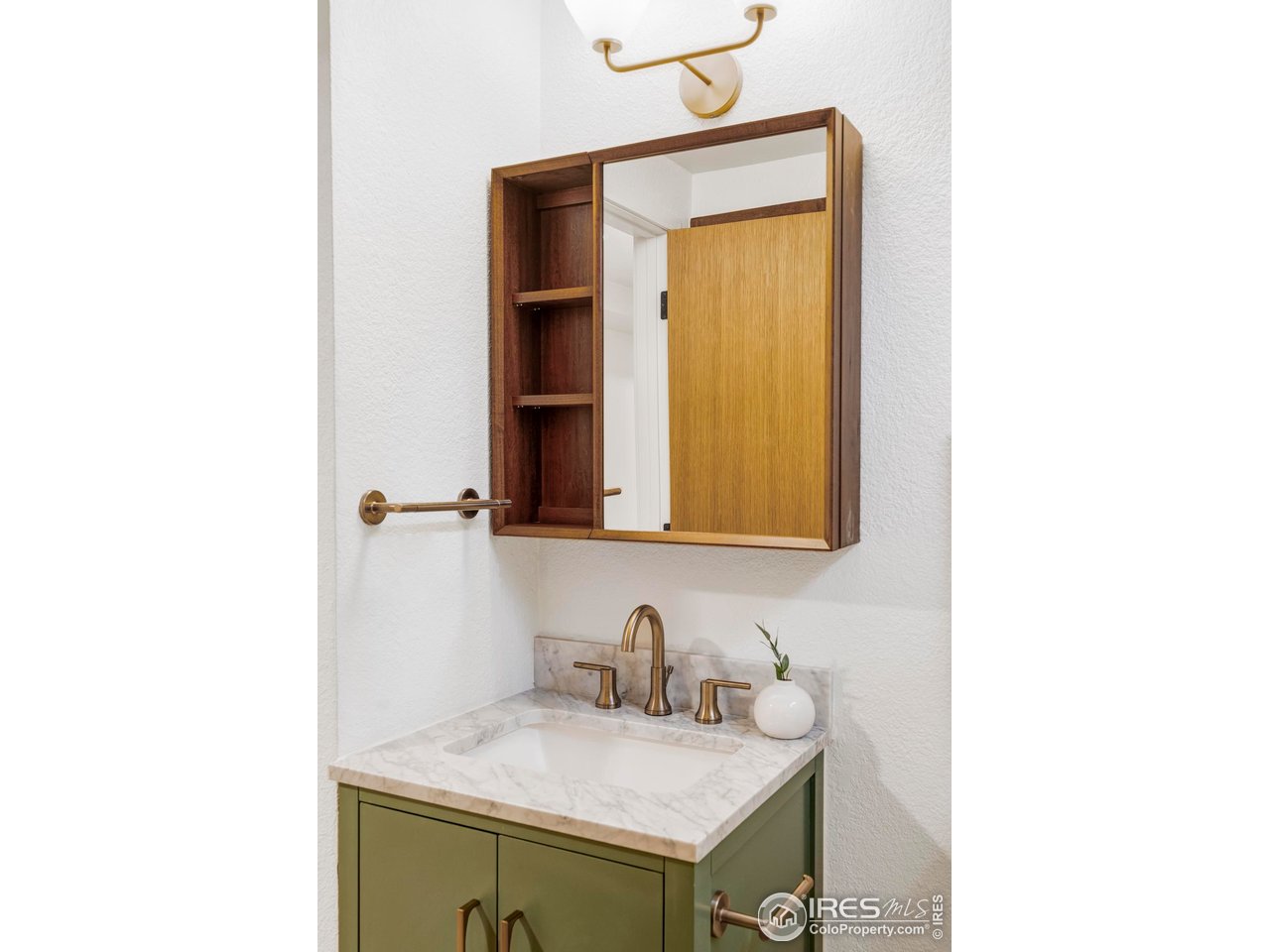1112 Robertson Street Fort Collins, CO 80524 - Photo 34 of 40 a bathroom with a sink and a mirror