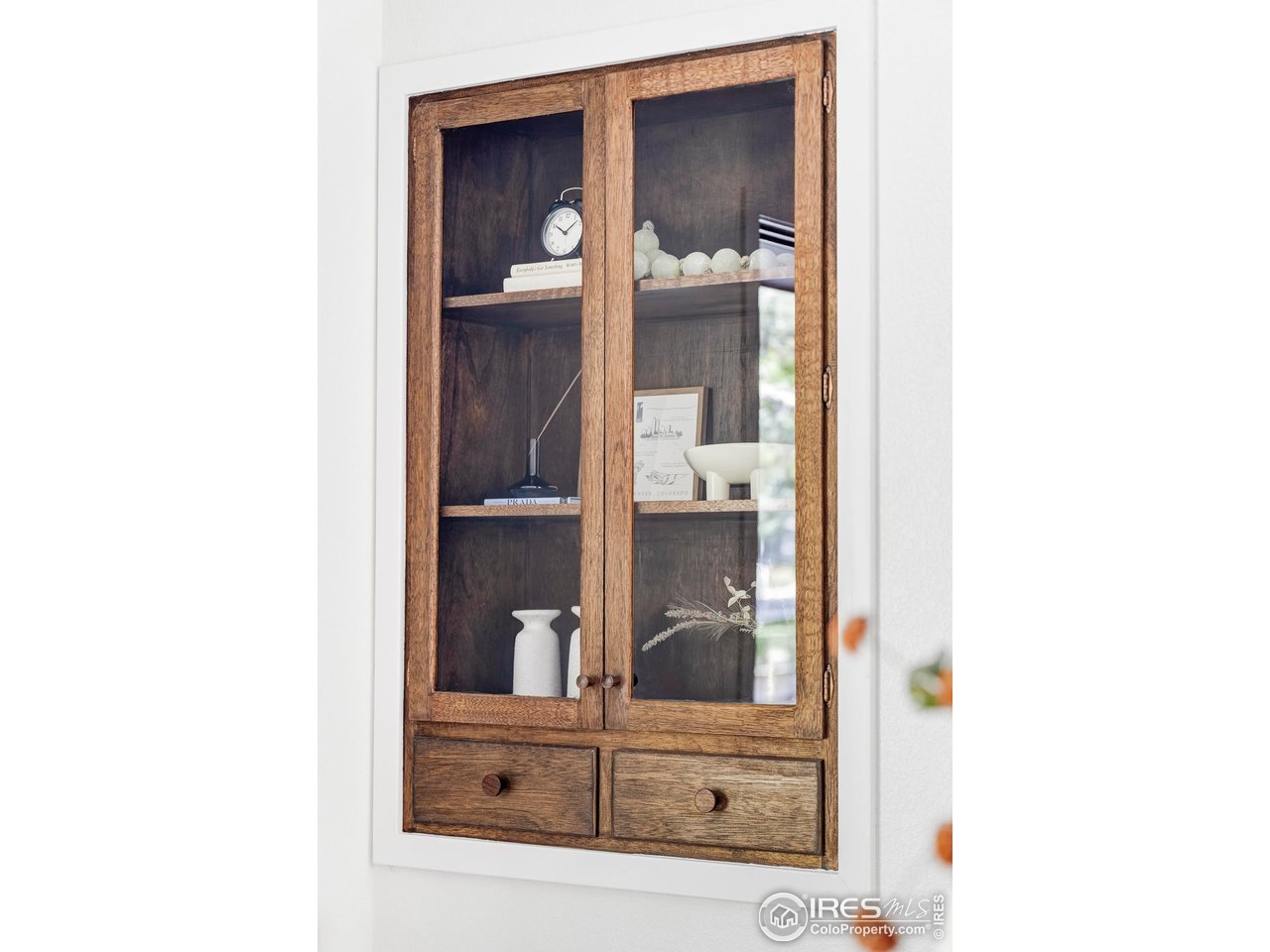 1112 Robertson Street Fort Collins, CO 80524 - Photo 6 of 40 a view of a hallway with cabinet and mirror