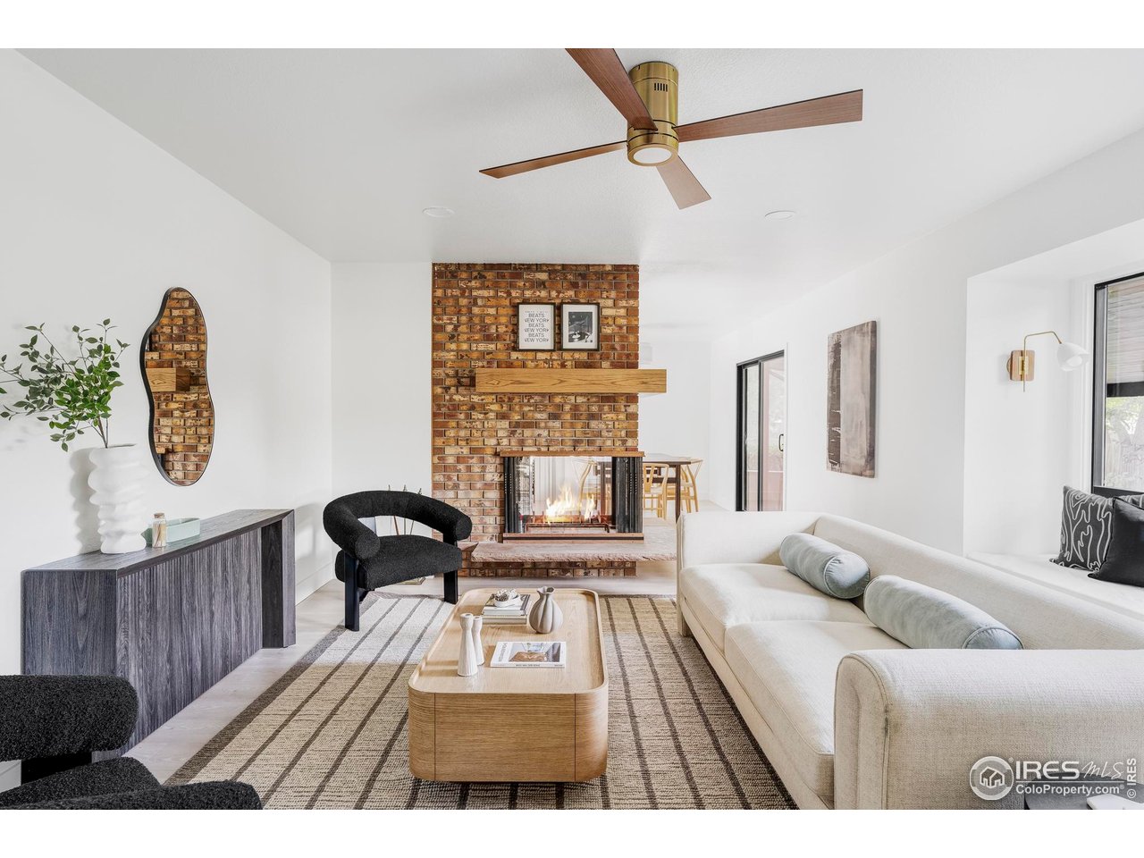 1112 Robertson Street Fort Collins, CO 80524 - Photo 7 of 40 a living room with furniture and a fireplace
