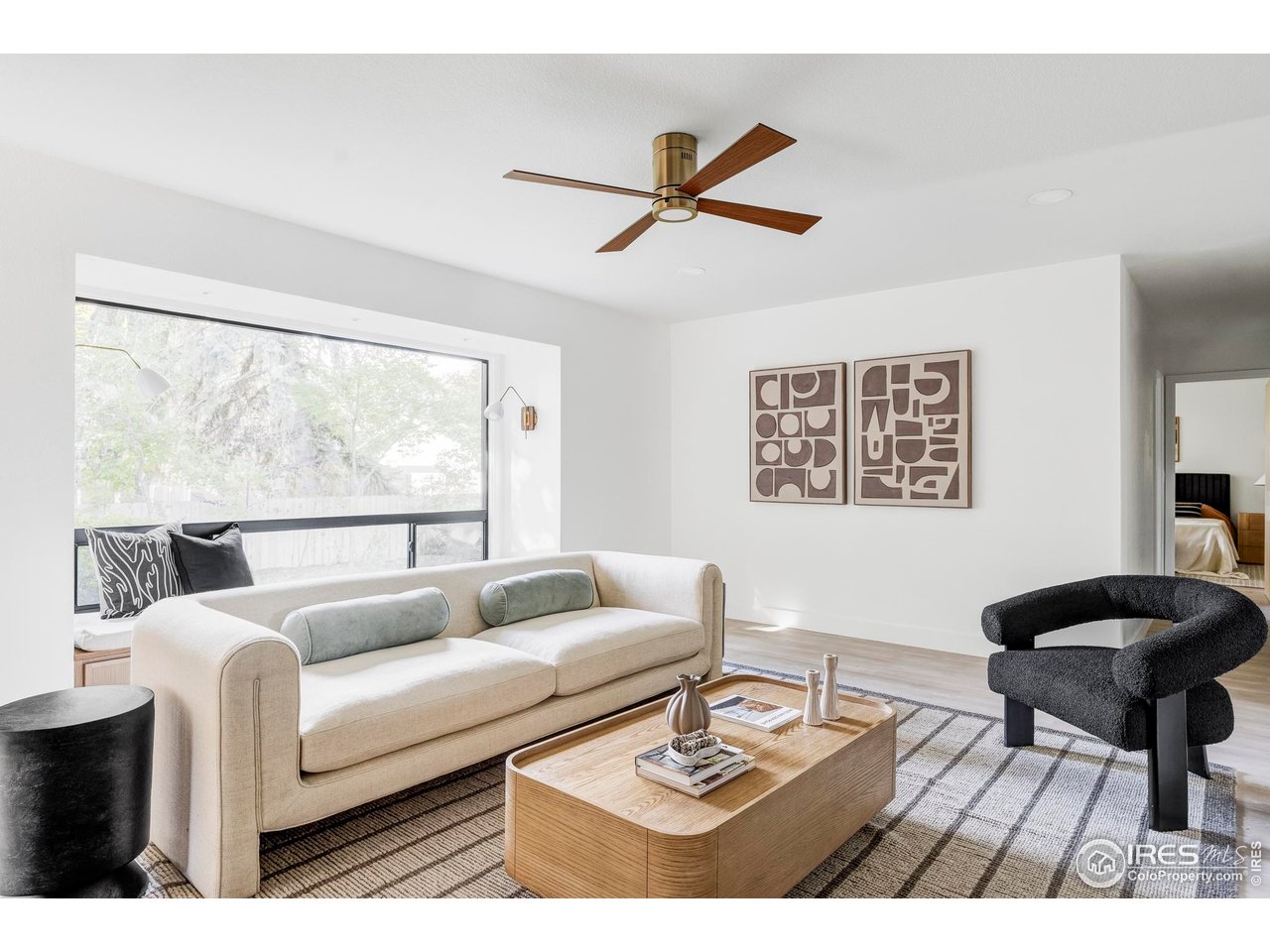 1112 Robertson Street Fort Collins, CO 80524 - Photo 8 of 40 a living room with furniture and a large window