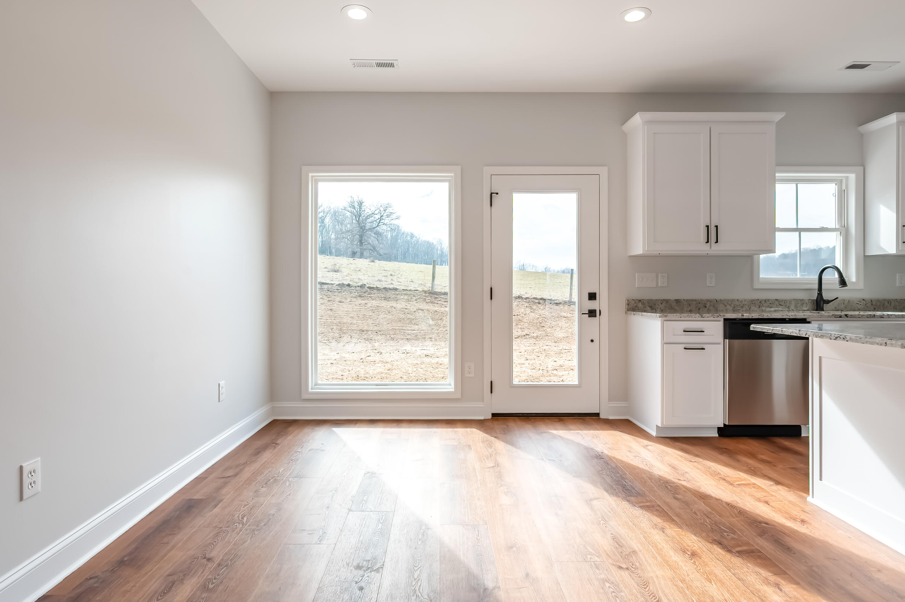 1047 Barberry Road Southeast Floyd, VA 24091 - Photo 11 of 50 a view of a kitchen with wooden floor and a window