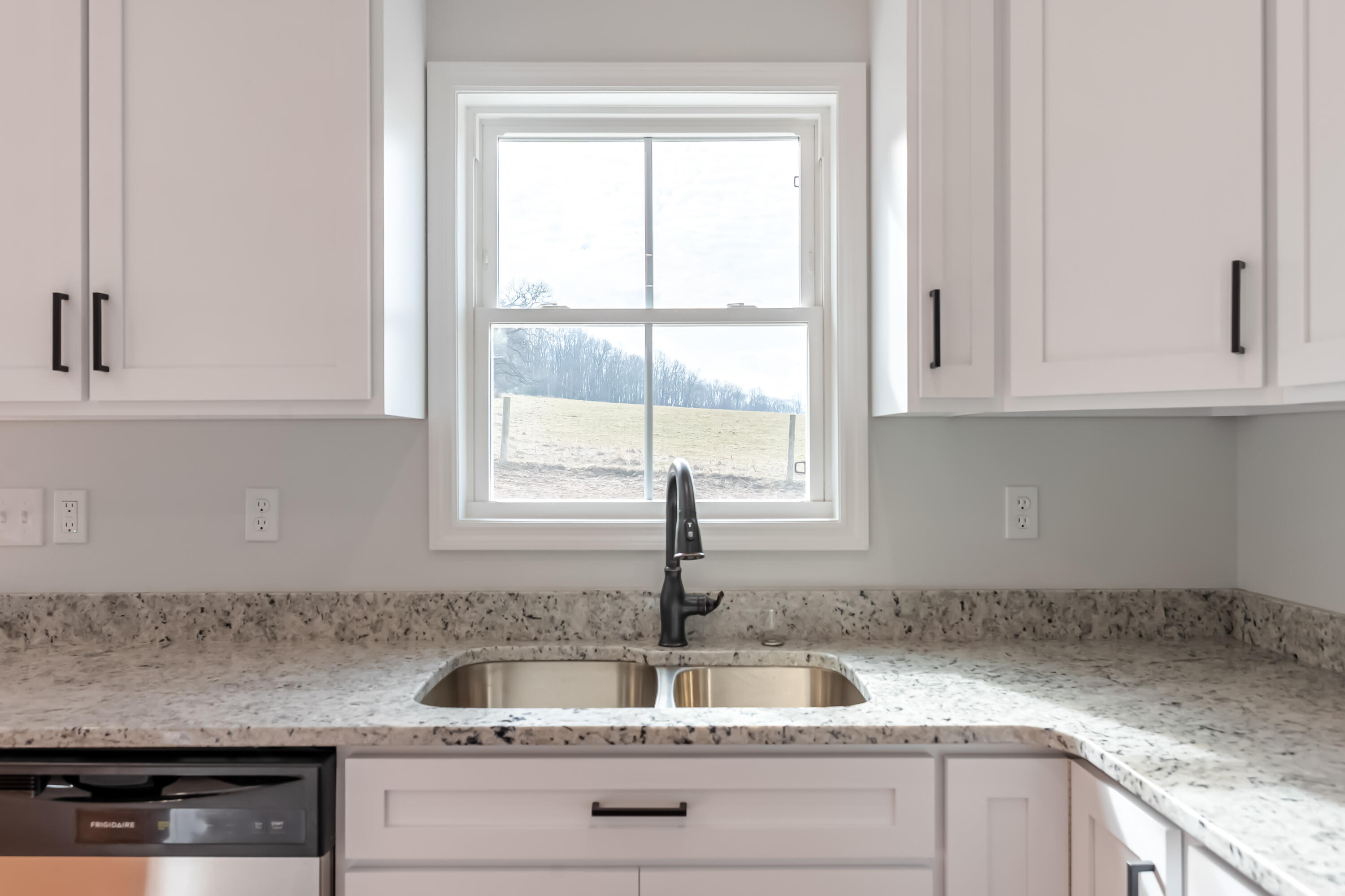 1047 Barberry Road Southeast Floyd, VA 24091 - Photo 17 of 50 a kitchen with granite countertop white cabinets and window