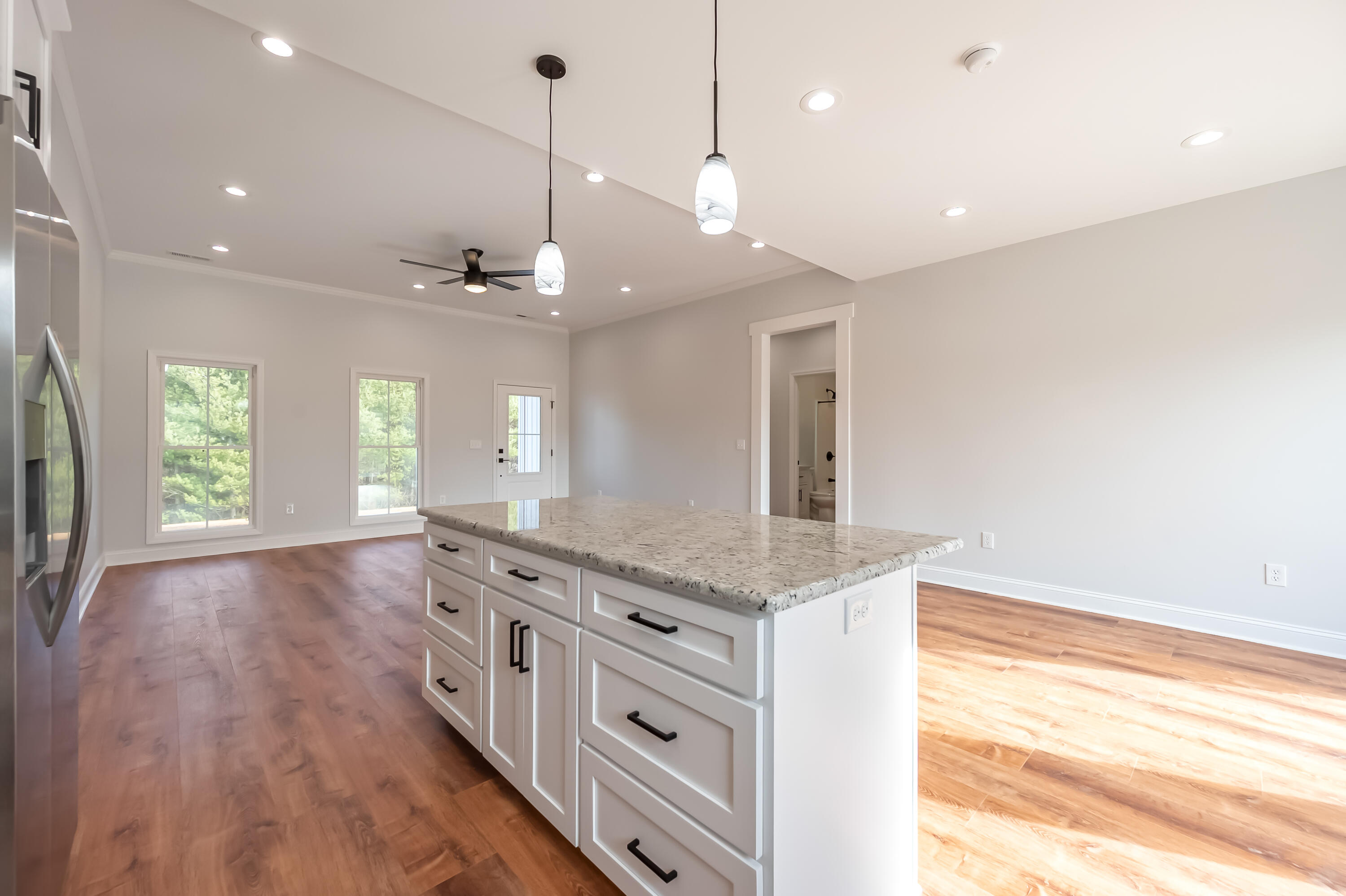 1047 Barberry Road Southeast Floyd, VA 24091 - Photo 18 of 50 a kitchen with stainless steel appliances granite countertop cabinets a stove a sink and a large window