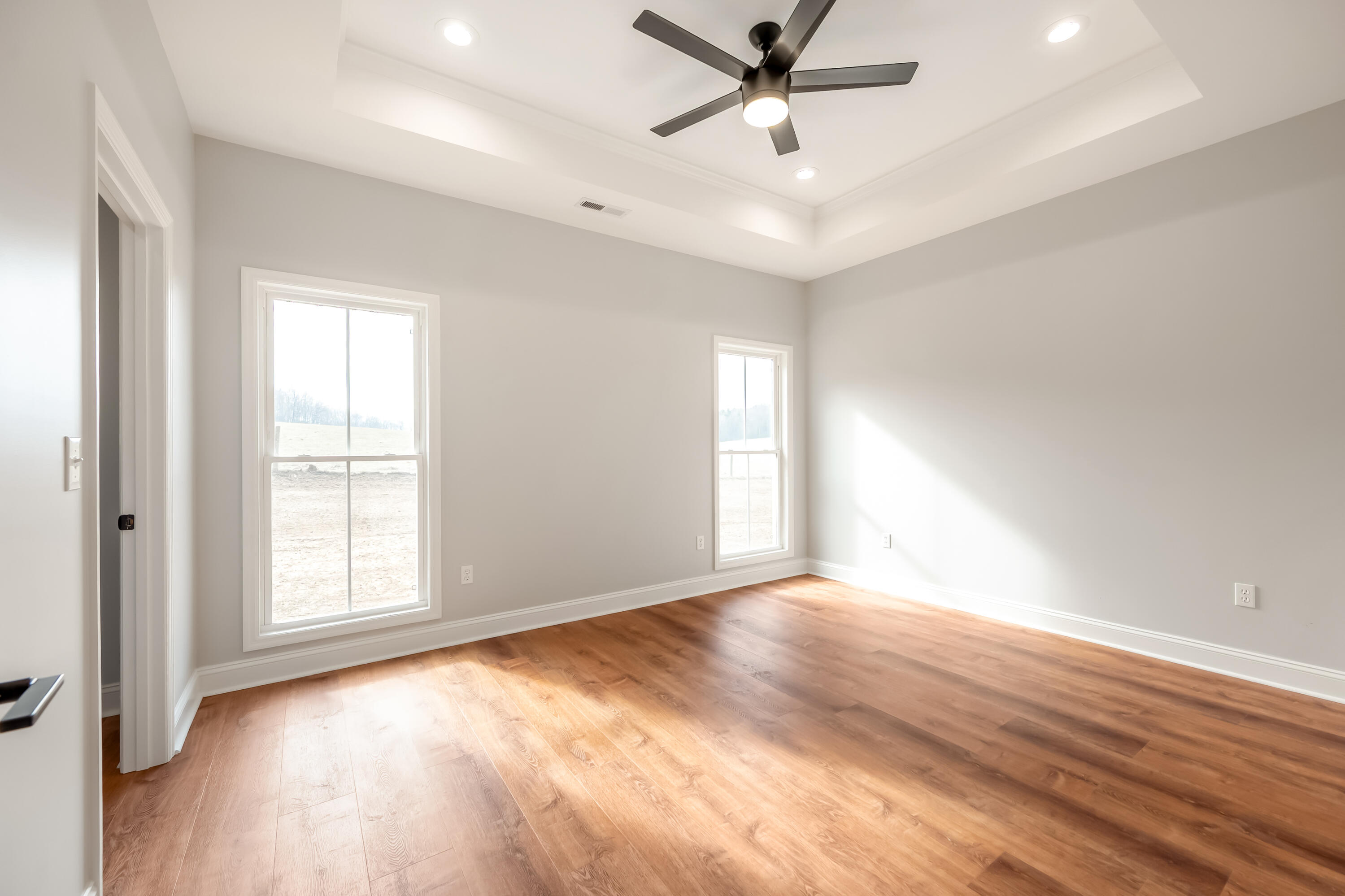1047 Barberry Road Southeast Floyd, VA 24091 - Photo 20 of 50 an empty room with wooden floor fan and windows