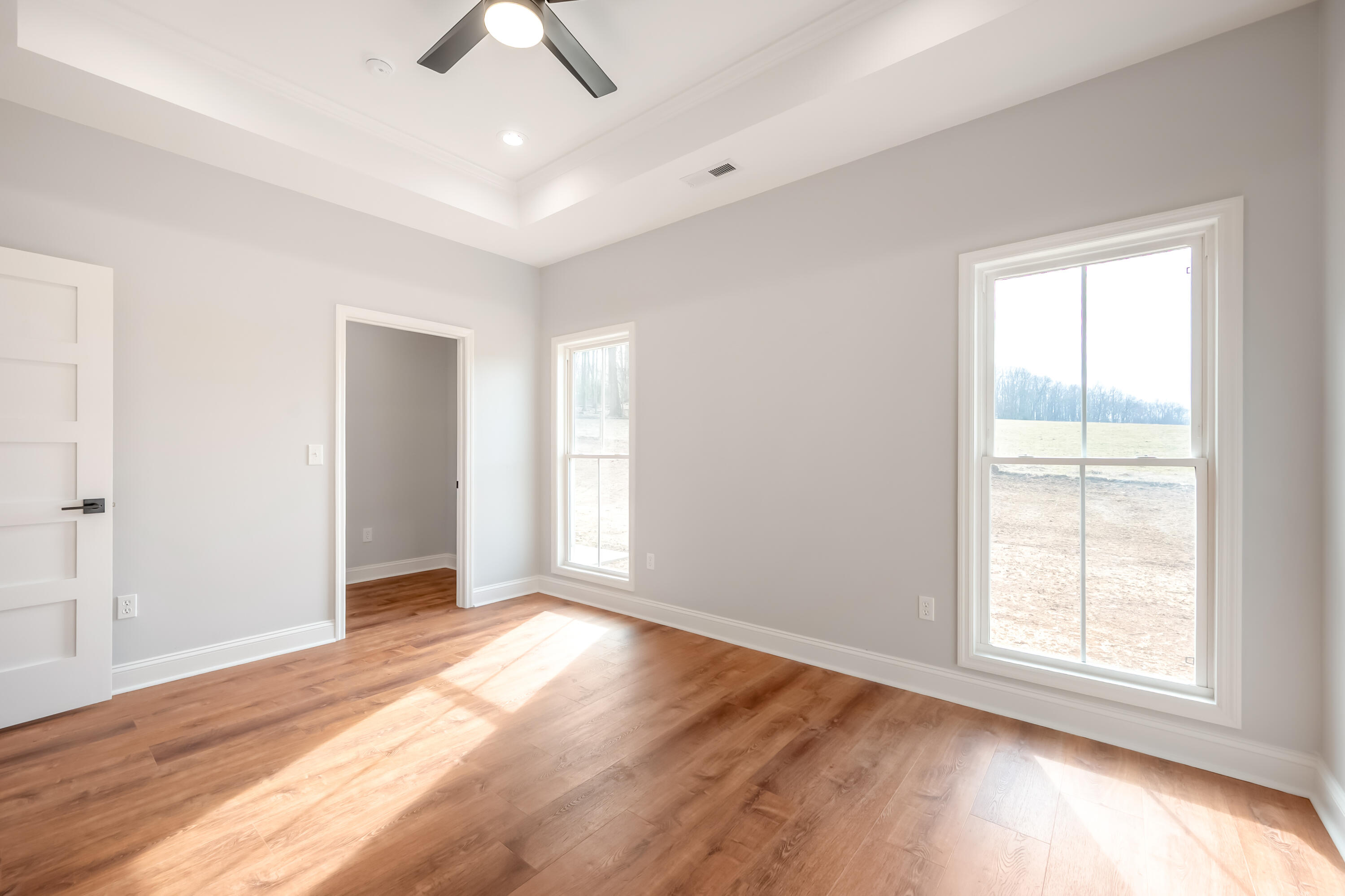 1047 Barberry Road Southeast Floyd, VA 24091 - Photo 21 of 50 an empty room with wooden floor fan and windows