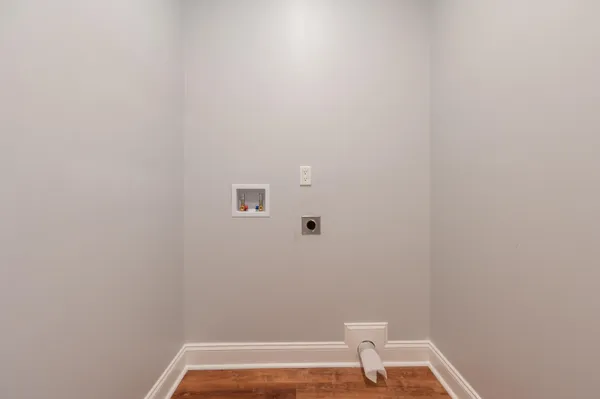 a view of a room with wooden floor and small space