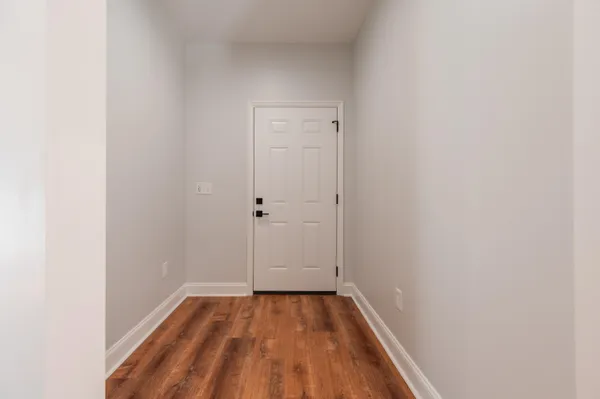 a bathroom with a granite countertop toilet and a shower
