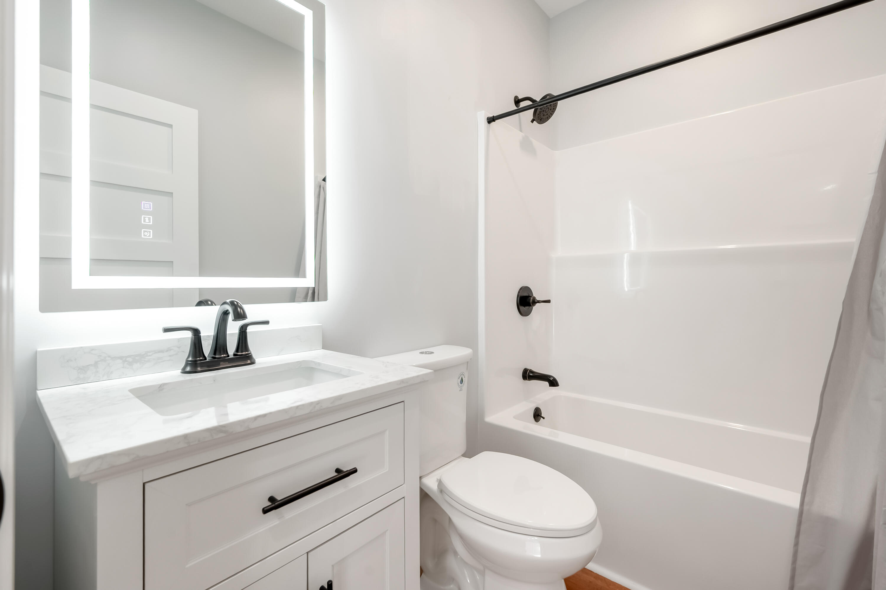 1047 Barberry Road Southeast Floyd, VA 24091 - Photo 34 of 50 a bathroom with a sink a mirror toilet and bathtub